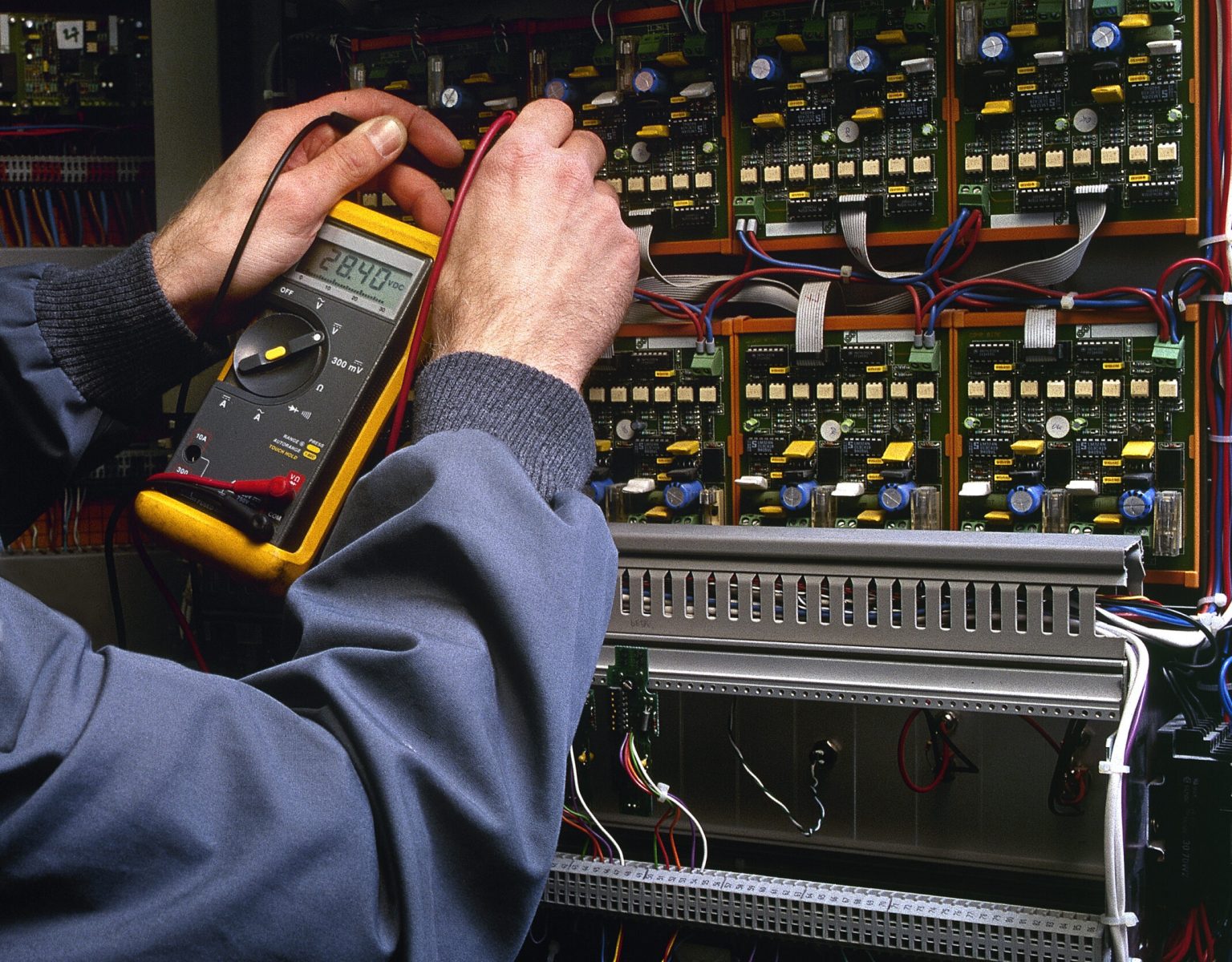 electrician testing industrial machine