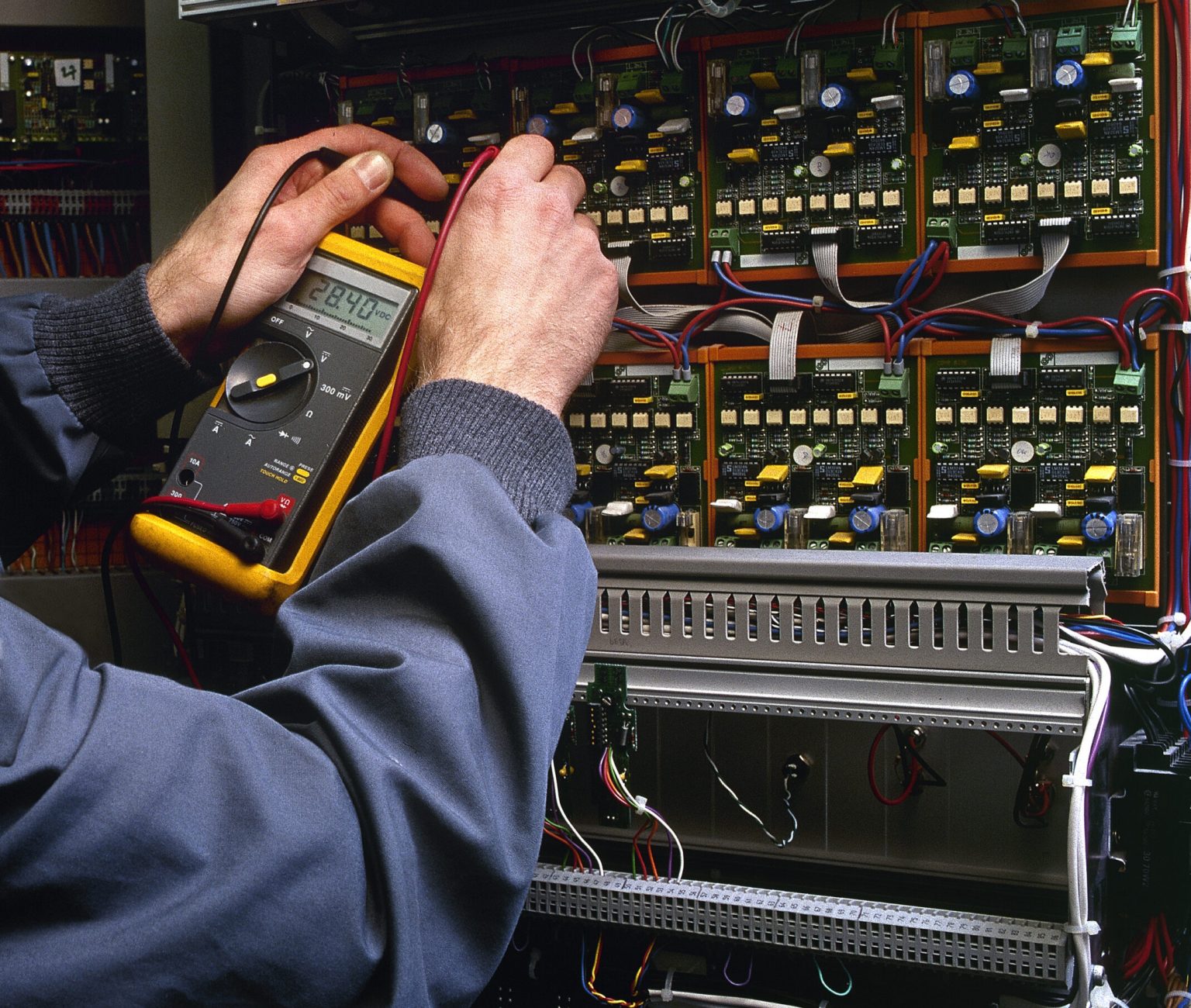 electrician testing industrial machine